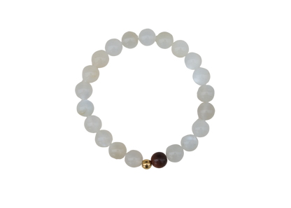 Beaded bracelet with white, gold, and brown beads on a white background