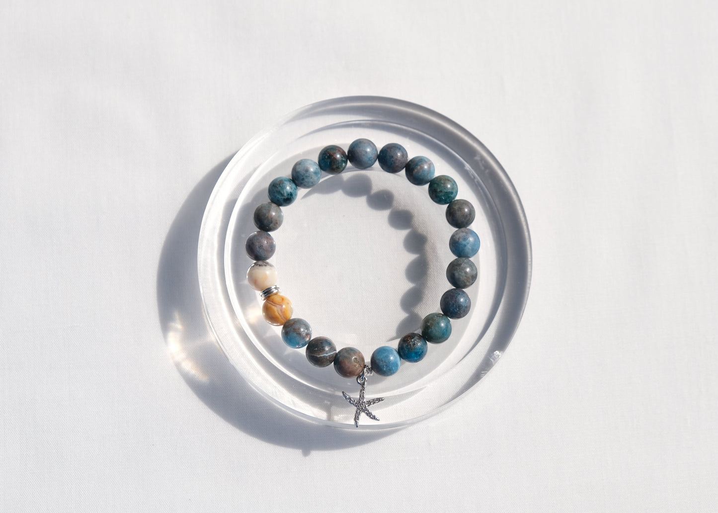 Bracelet with multicolored beads on a white background