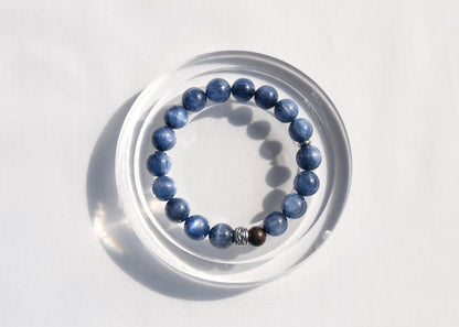 Blue beaded bracelet on a white surface