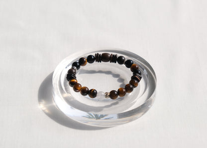 Beaded bracelet on a clear stand with a white background
