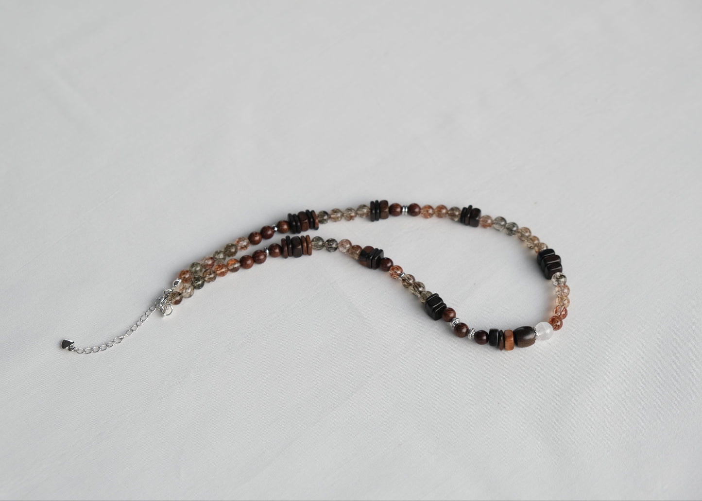 Beaded necklace on a light gray background