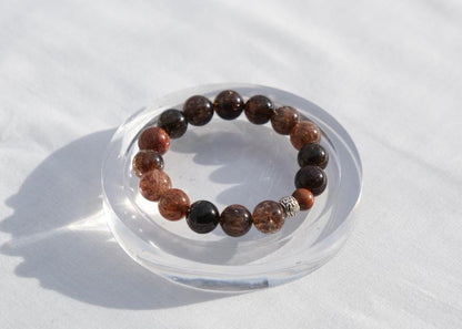 Beaded bracelet on a clear stand with a white background
