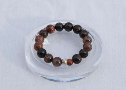 Beaded bracelet on a clear stand with a white background