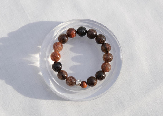 Beaded bracelet on a clear stand with a white background