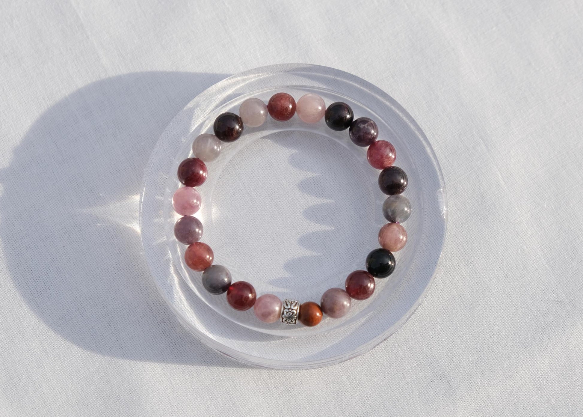 Bracelet with multicolored beads on a white surface